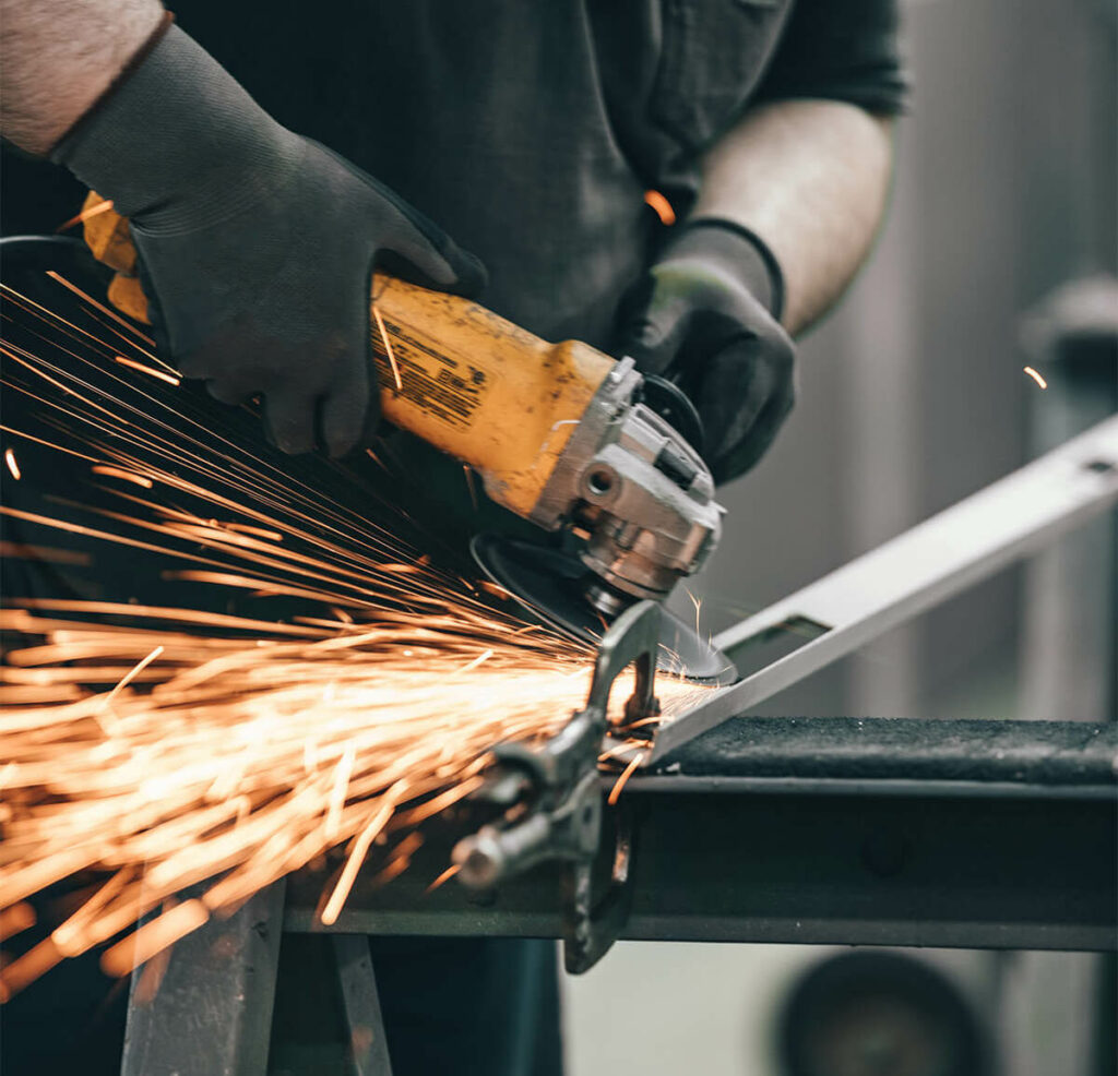 An employee working on a bespoke fabrication project.